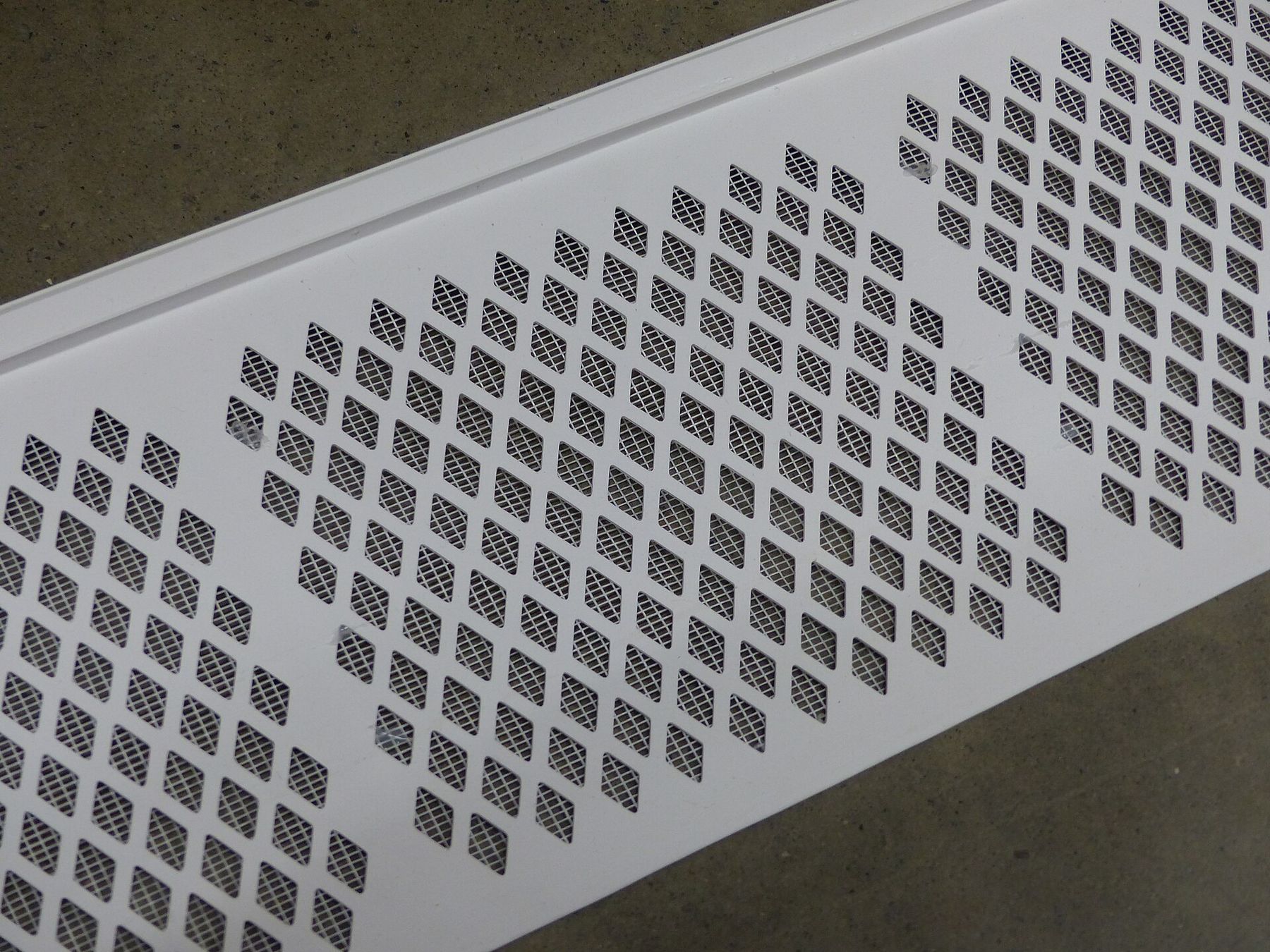 A plastic gutter guard with diamond perforations